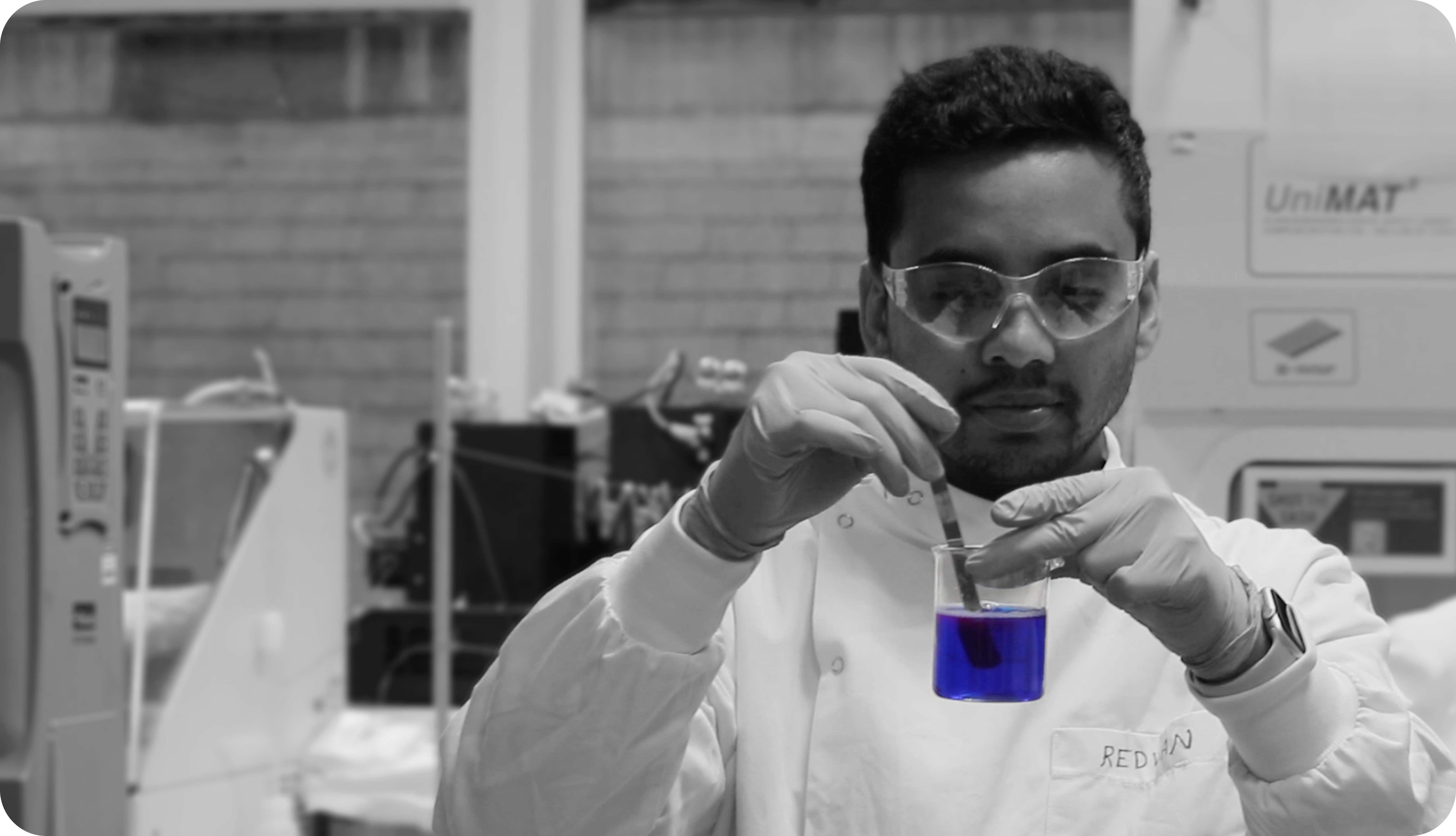 Scientist mixing algae dyes